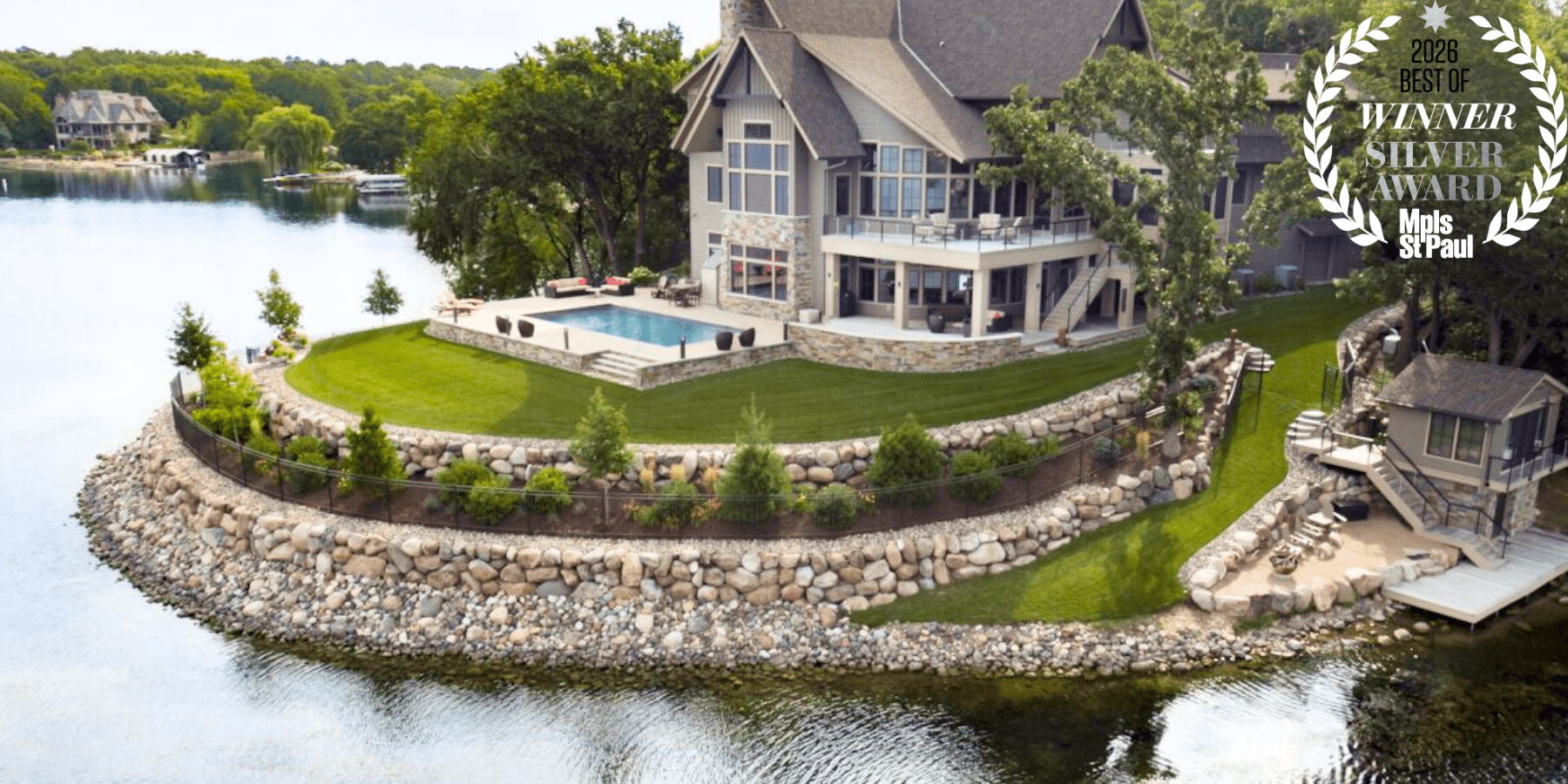 Lakeside house with pool and scenic view.