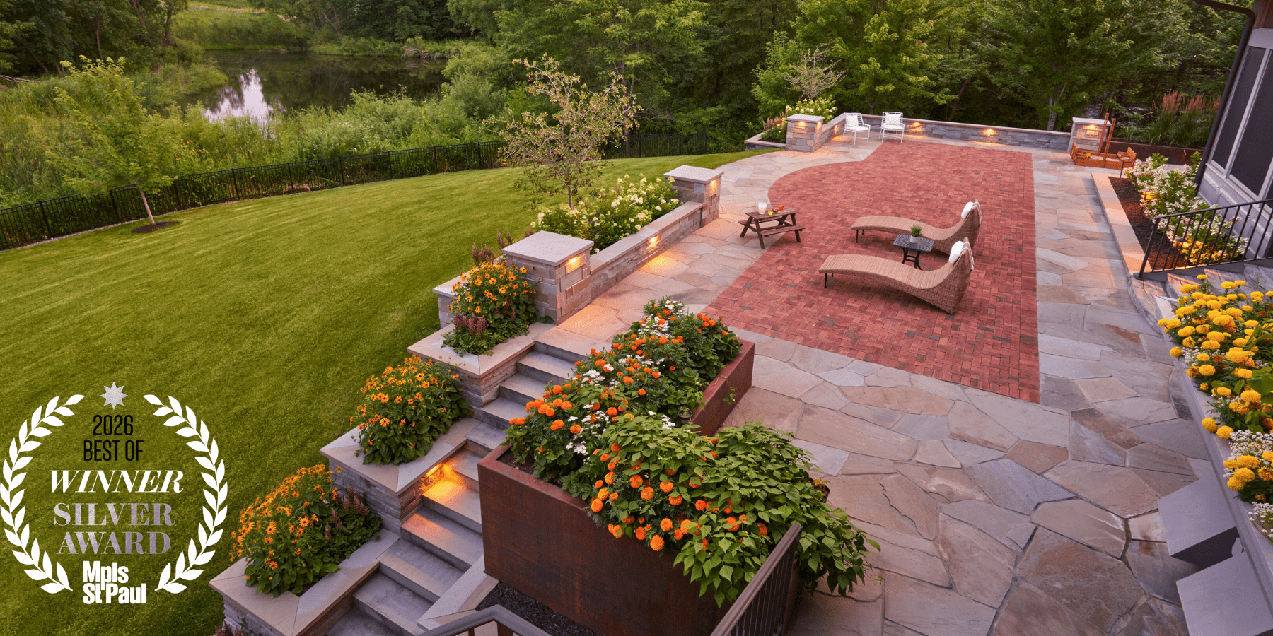Award-winning garden with patio and colorful flowers.