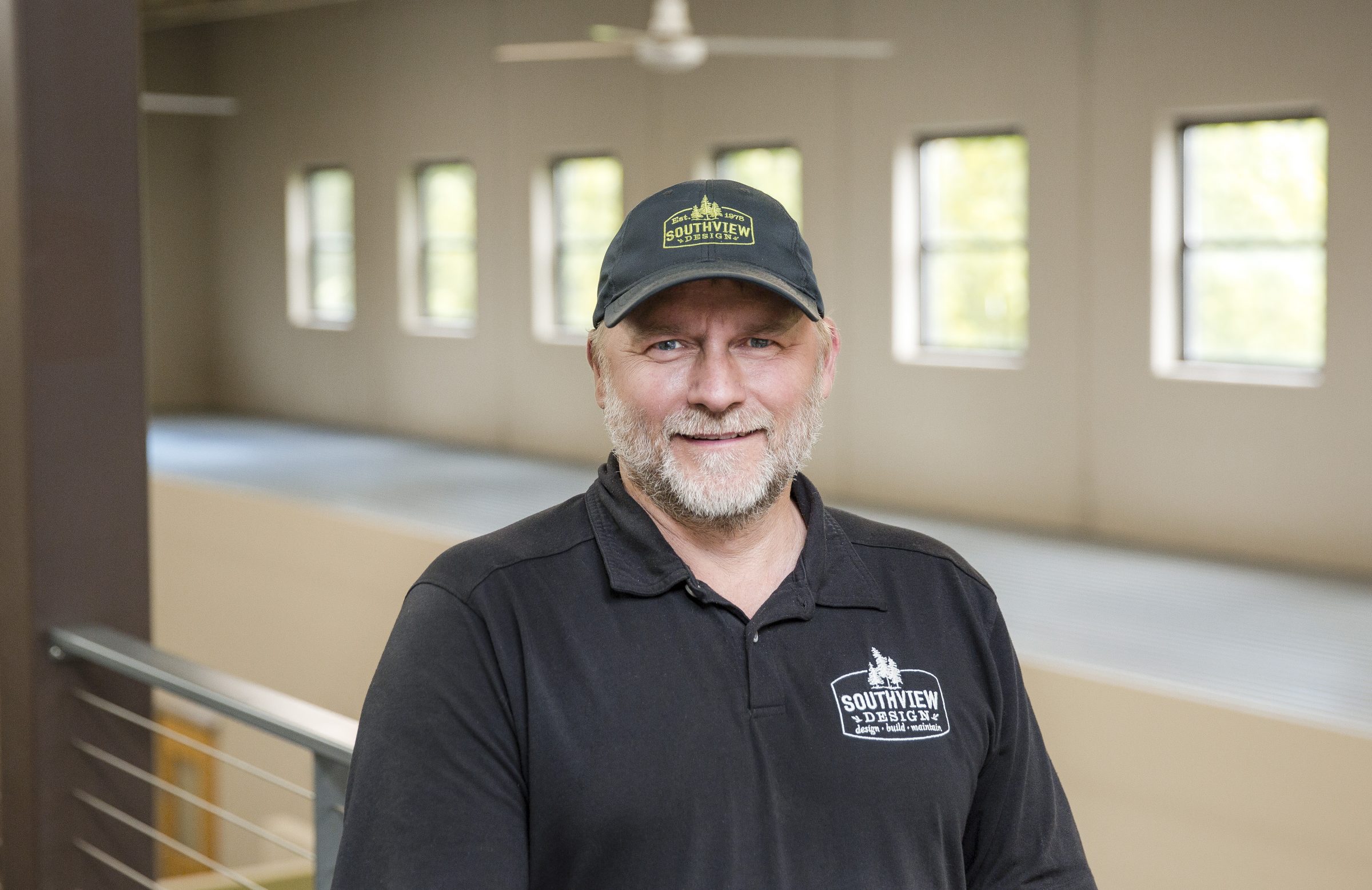 Man in Southview Design cap and polo smiling