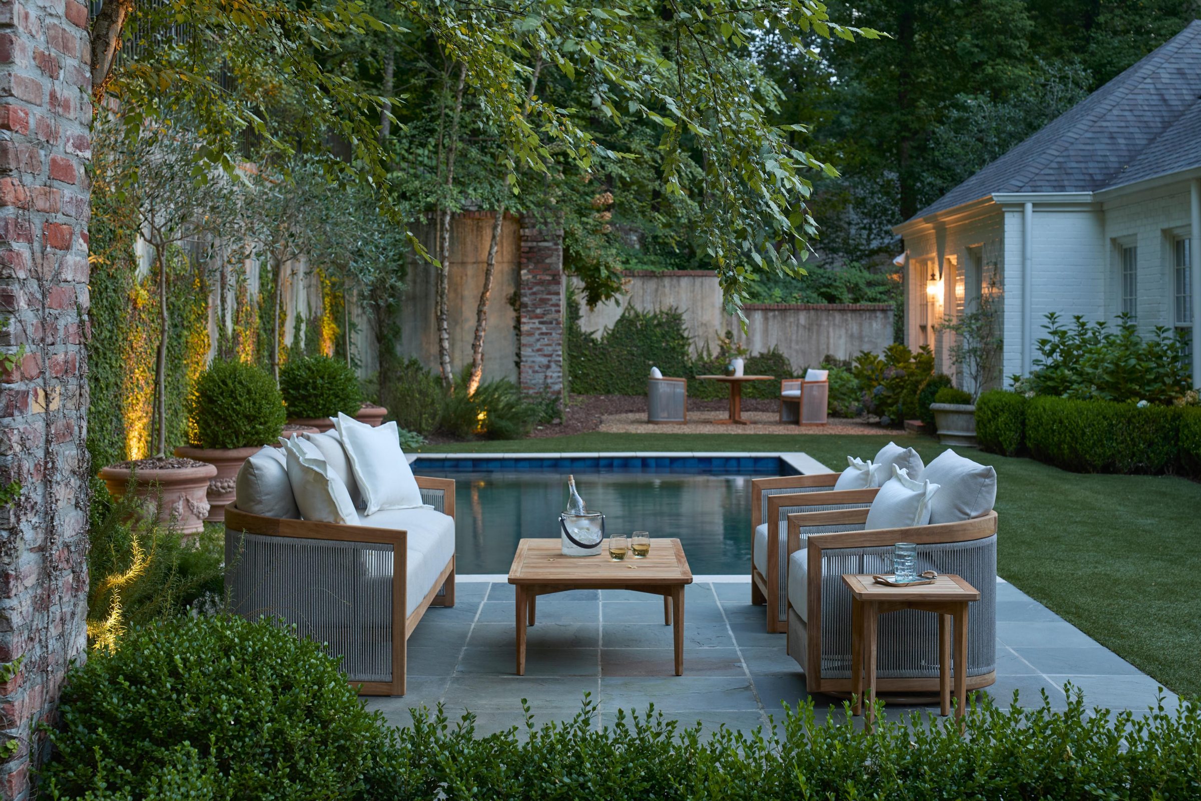 Elegant backyard patio with pool and seating area