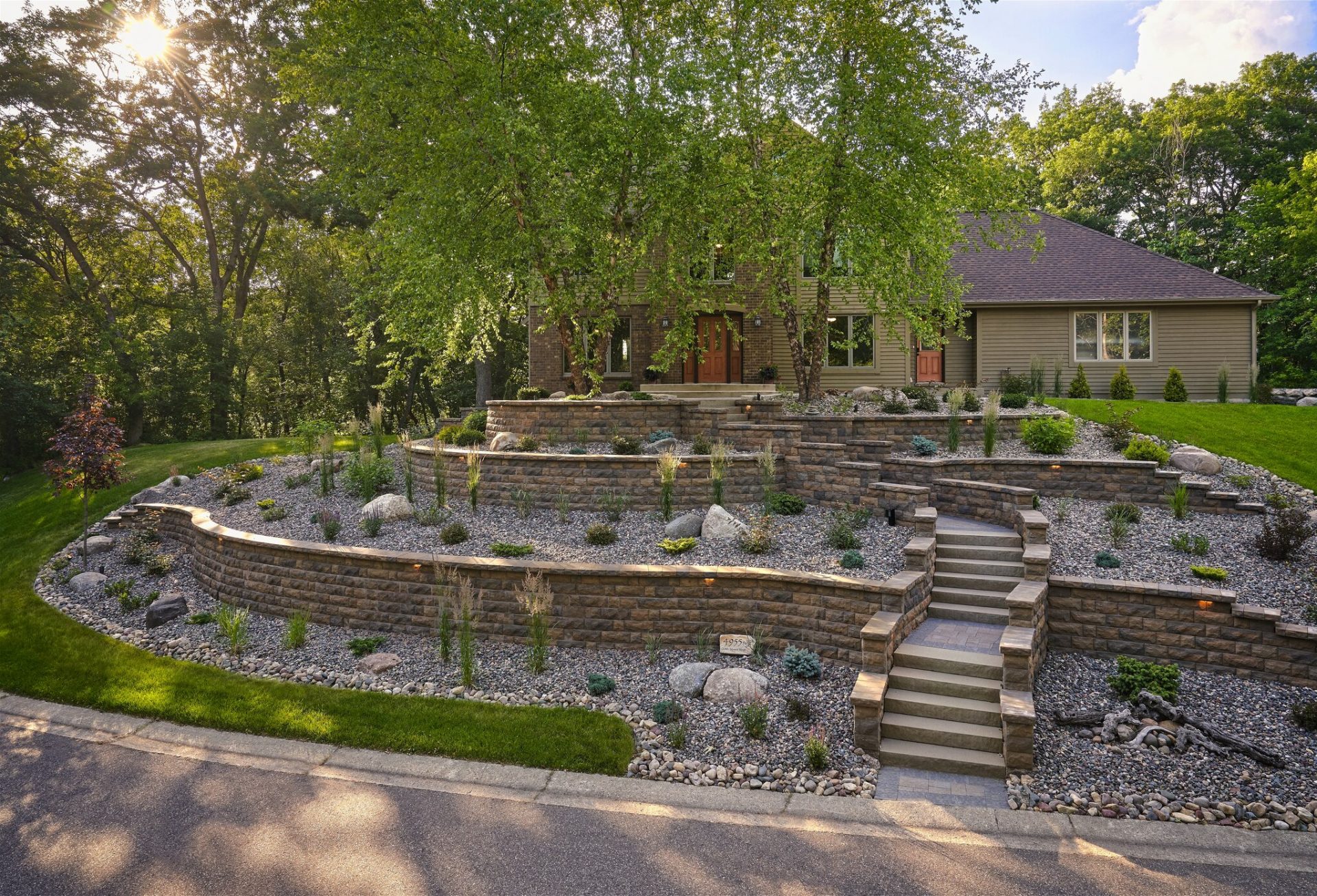 Beautiful terraced garden landscaping with stone walls.