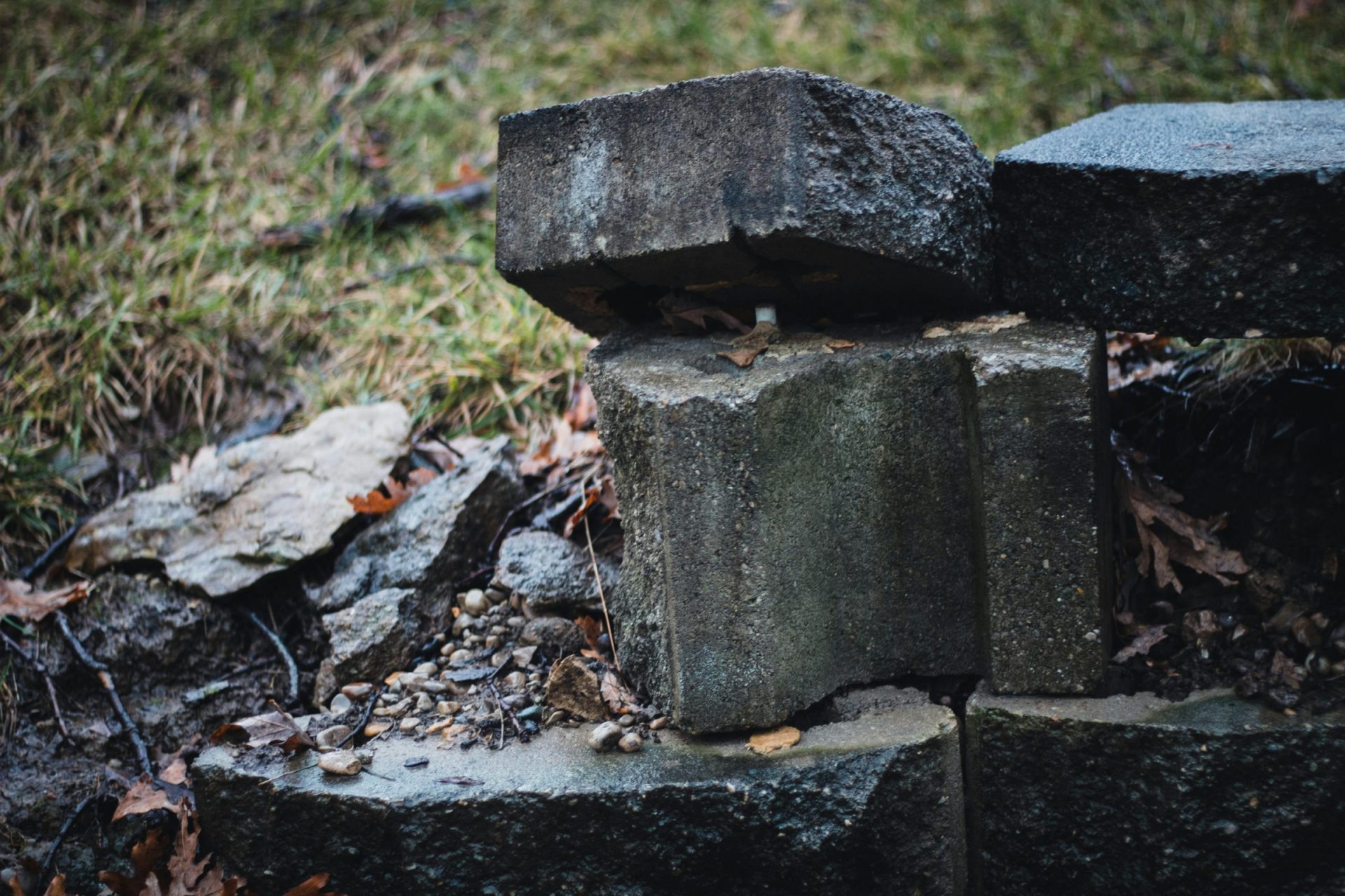 Stacked concrete blocks on grassy surface