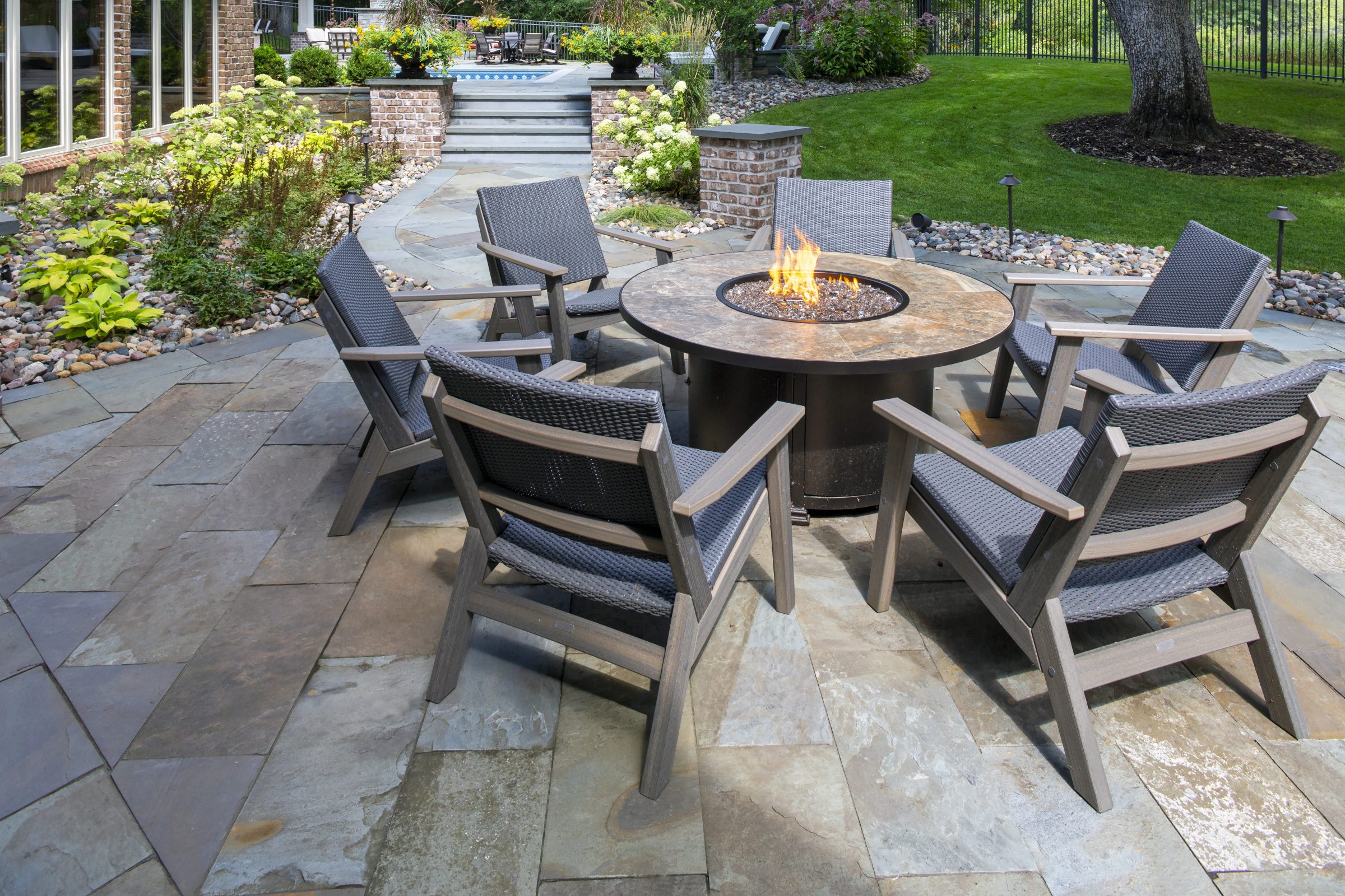 Outdoor patio with fire pit and chairs