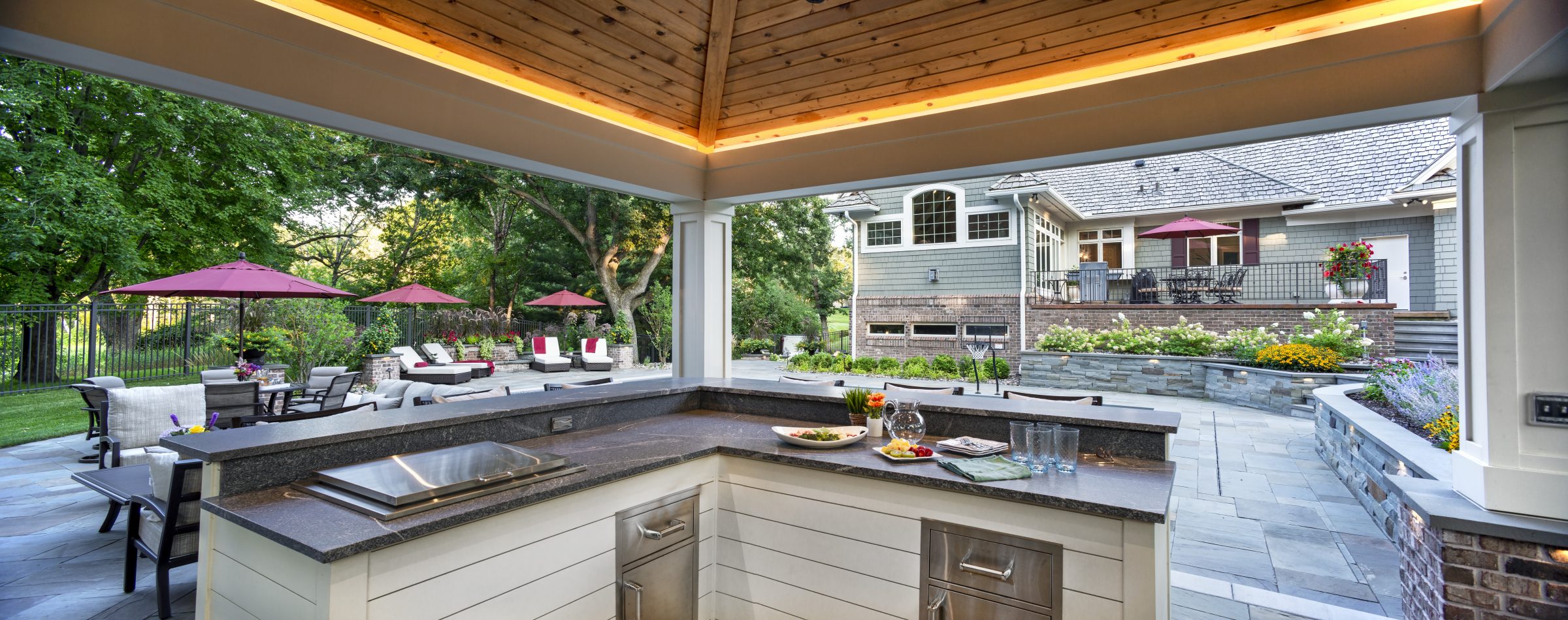 Outdoor kitchen with patio and garden view