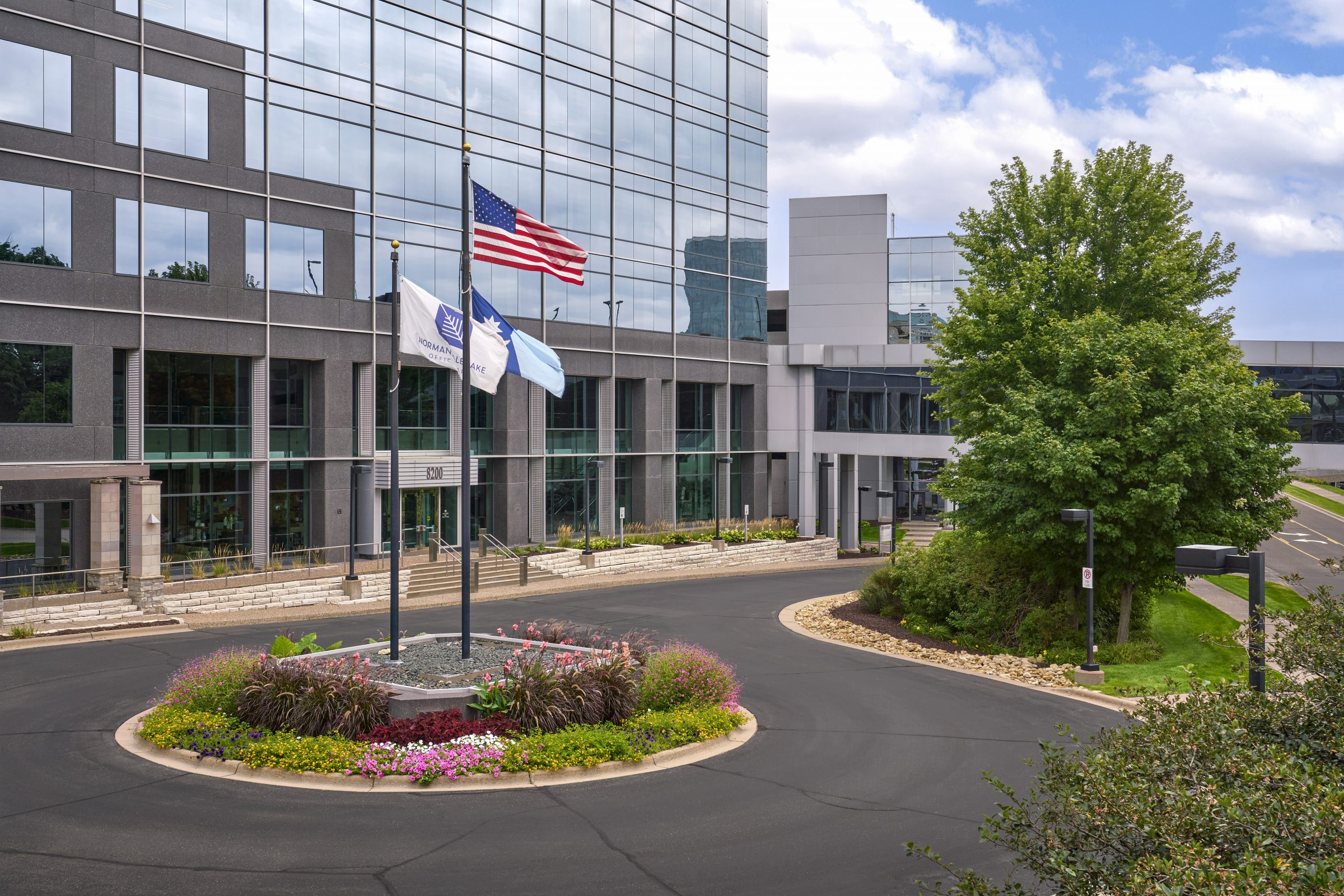 Colorful annual flower bed in the entrance roundabout at Normandale Lakes Office Park in Bloomington, MN