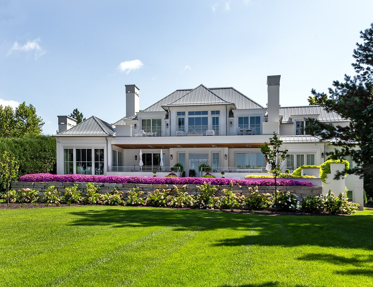 Modern house with landscaped garden and flowers.