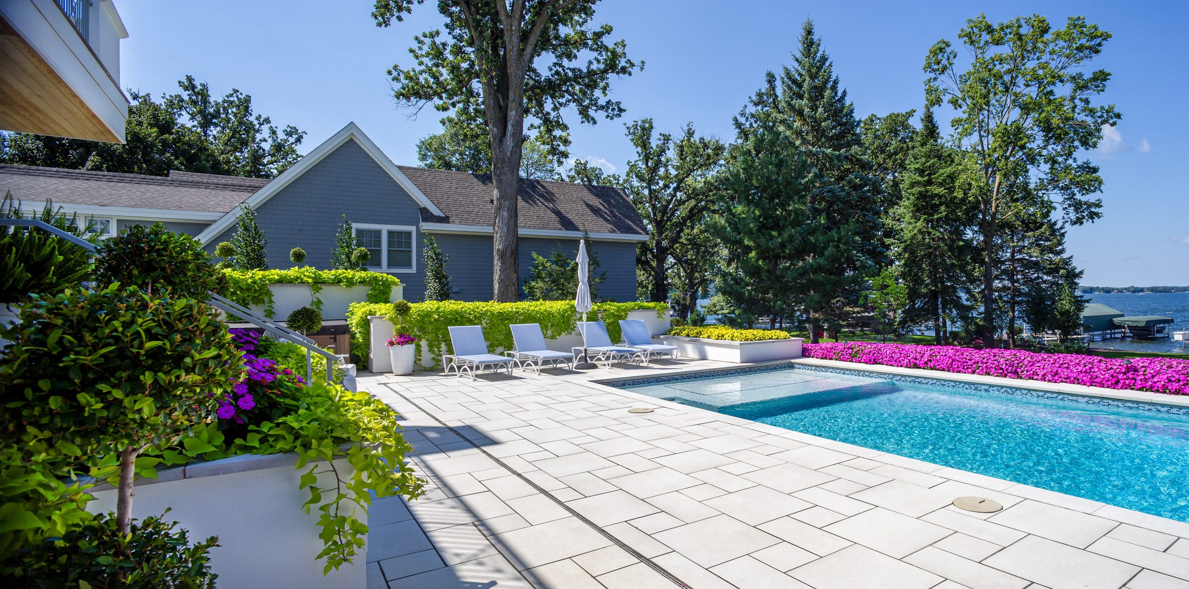 Lakeside house with pool and garden