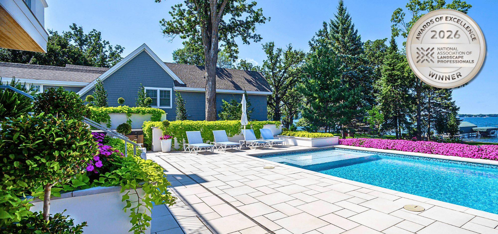 Award-winning backyard garden with pool and lounge chairs.