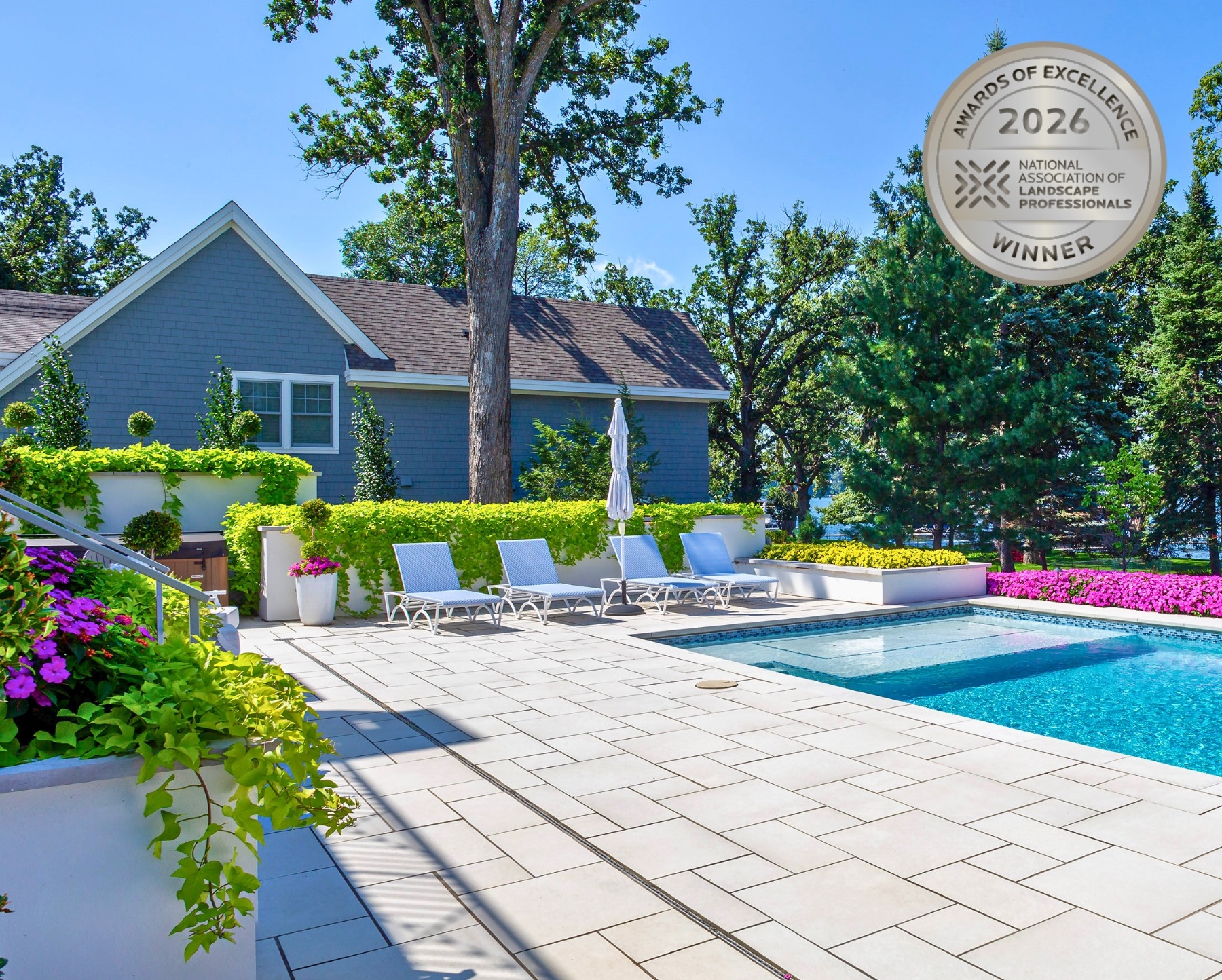 Award-winning backyard with pool and lounge chairs.